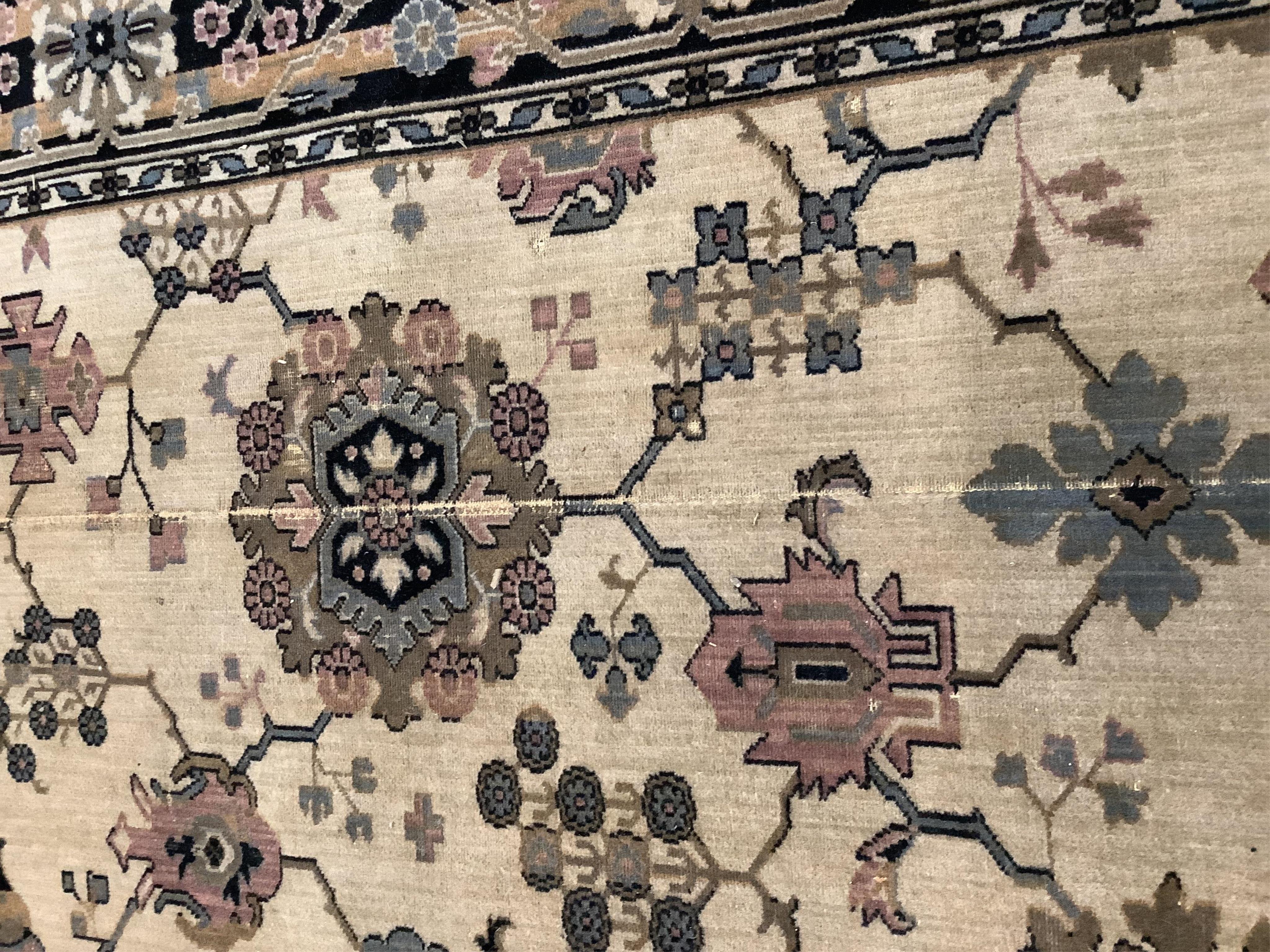 A Hamadan ivory ground carpet, 325 x 205cm